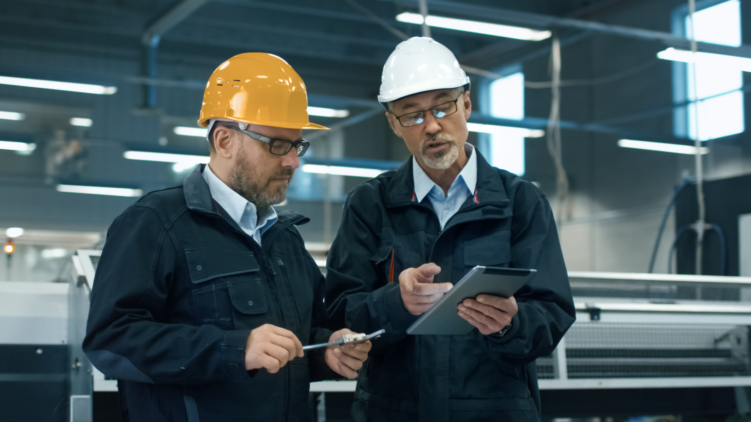 Construction Worker Taking Out Blueprint Tube Stock Photo by